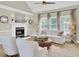 Bright living room with fireplace, vaulted ceiling and plush seating at 16 Oatly Cir, Charleston, SC 29414
