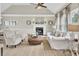 Bright living room with vaulted ceiling, showcasing a fireplace, comfortable seating, and stylish decor at 16 Oatly Cir, Charleston, SC 29414