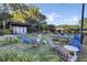 Charming outdoor area with multiple seating arrangements surrounded by lush landscaping at 16 Oatly Cir, Charleston, SC 29414