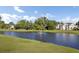 Scenic view of a pond on the golf course with a fountain and houses in the background at 16 Oatly Cir, Charleston, SC 29414