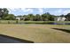 Scenic view of a pond on the golf course with a fountain and golfers on the green at 16 Oatly Cir, Charleston, SC 29414