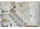 Carpeted stairs with white wood railing, with a view leading to the next level at 16 Oatly Cir, Charleston, SC 29414