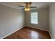 Bedroom featuring a ceiling fan, window and wood flooring at 1705 Falcon Cove Ln, Hanahan, SC 29410