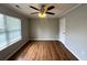 Bedroom with a ceiling fan, a window and laminate flooring at 1705 Falcon Cove Ln, Hanahan, SC 29410