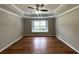 Bedroom featuring tray ceiling, window and wood flooring at 1705 Falcon Cove Ln, Hanahan, SC 29410