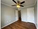 Bedroom featuring a ceiling fan, wood floors, and white trim at 1705 Falcon Cove Ln, Hanahan, SC 29410