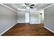 Bedroom featuring tray ceiling, door and wood flooring at 1705 Falcon Cove Ln, Hanahan, SC 29410