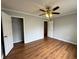 Bedroom with a ceiling fan, closet and doorway with wood floors at 1705 Falcon Cove Ln, Hanahan, SC 29410