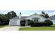 Charming single-story home features a well-maintained lawn, lovely front bushes, and an attached garage at 1705 Falcon Cove Ln, Hanahan, SC 29410