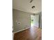 Functional laundry room with wood flooring, washer and dryer hookups, a door to the backyard at 1705 Falcon Cove Ln, Hanahan, SC 29410