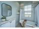 Traditional bathroom with clawfoot tub and marble topped vanity with sink at 173 Fishburne St, Charleston, SC 29403