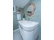 Stylish bathroom featuring a basin sink with sleek lines, and a striking wooden mirror, and decor at 173 Fishburne St, Charleston, SC 29403