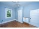 Bedroom with built in storage and hardwood flooring with window letting in natural light at 173 Fishburne St, Charleston, SC 29403