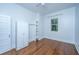 Bedroom with hardwood flooring and a built in closet and shelving unit at 173 Fishburne St, Charleston, SC 29403