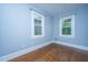 Bedroom showcases hardwood floors with view of two windows at 173 Fishburne St, Charleston, SC 29403