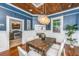 Dining room with table, chairs, wood ceiling, and a glimpse into the kitchen at 173 Fishburne St, Charleston, SC 29403