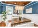Dining room with wood ceiling, decorative lighting, wood dining table, and chairs at 173 Fishburne St, Charleston, SC 29403