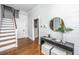 Bright entryway featuring hardwood floors, a staircase, and tasteful decor at 173 Fishburne St, Charleston, SC 29403