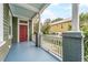 Inviting front porch with colorful flooring and a classic railing, perfect for relaxing outdoors at 173 Fishburne St, Charleston, SC 29403