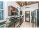 Updated kitchen features stainless steel appliances, granite countertops, and abundant natural light from a window and glass door at 173 Fishburne St, Charleston, SC 29403
