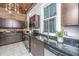 Kitchen showcases granite countertops, stainless steel appliances and lots of windows letting in ample light at 173 Fishburne St, Charleston, SC 29403