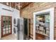 View of the kitchen with stainless steel refrigerator and doorway view into the dining room at 173 Fishburne St, Charleston, SC 29403