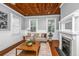 Comfortable living room with a wooden ceiling, ample seating, and a decorative fireplace at 173 Fishburne St, Charleston, SC 29403