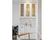 Stylish wet bar with white cabinetry, countertops, and glass-door upper cabinets at 1815 Long Bend Dr, Seabrook Island, SC 29455