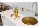 Modern bar with a copper sink, stainless steel faucet, and stylish gold barware at 1815 Long Bend Dr, Seabrook Island, SC 29455