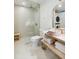 A well-lit bathroom boasts a glass shower, pink vessel sink, and sleek tile flooring at 1815 Long Bend Dr, Seabrook Island, SC 29455