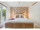 Bedroom featuring modern bed, neutral rug, and bright, wallpapered accent wall at 1815 Long Bend Dr, Seabrook Island, SC 29455