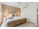 Bedroom with a wallpapered accent wall and a bright, stylish look at 1815 Long Bend Dr, Seabrook Island, SC 29455