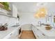 Modern kitchen featuring white countertops, stylish pendant lights, and stainless steel appliances at 1815 Long Bend Dr, Seabrook Island, SC 29455