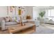 Inviting living room features a sectional sofa, neutral color scheme, and modern art at 1815 Long Bend Dr, Seabrook Island, SC 29455