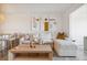 Cozy living room featuring a sectional sofa, a wooden coffee table, and modern art at 1815 Long Bend Dr, Seabrook Island, SC 29455