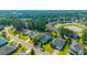Residential neighborhood showcasing well-maintained homes, tree-lined streets, and a serene community pond at 185 Red Leaf Blvd, Moncks Corner, SC 29461