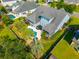 Aerial view of backyard featuring a refreshing pool, lush landscaping, and a fenced perimeter for privacy at 185 Red Leaf Blvd, Moncks Corner, SC 29461