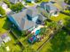 Spacious backyard featuring a sparkling pool, mature trees, and a cozy patio area for outdoor enjoyment at 185 Red Leaf Blvd, Moncks Corner, SC 29461