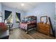 Bedroom features wood floors, a bunk bed, a ceiling fan, and natural light from the window at 185 Red Leaf Blvd, Moncks Corner, SC 29461