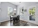 Dining area with wood floors, natural light, and access to the outdoor deck at 185 Red Leaf Blvd, Moncks Corner, SC 29461