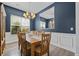 Elegant dining room with ample seating, natural light, and modern chandelier at 185 Red Leaf Blvd, Moncks Corner, SC 29461