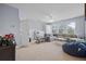 Spacious living room with neutral tones, lots of natural light, and a large sectional couch at 185 Red Leaf Blvd, Moncks Corner, SC 29461