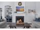 Inviting living room with fireplace, built-in shelving, and cozy seating at 185 Red Leaf Blvd, Moncks Corner, SC 29461