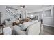 Bright and open living area featuring a staircase, wood floors, and view to the kitchen at 185 Red Leaf Blvd, Moncks Corner, SC 29461