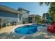Backyard pool area, complete with comfortable seating, lounge chairs, and ample space for relaxation at 185 Red Leaf Blvd, Moncks Corner, SC 29461
