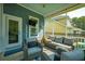 Inviting screened porch featuring ample seating arrangements and a stylish ceiling fan for a comfortable outdoor experience at 185 Red Leaf Blvd, Moncks Corner, SC 29461