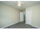 A charming bedroom features a ceiling fan, closet, and neutral paint, offering a cozy retreat at 2003 Savage Rd, Charleston, SC 29407