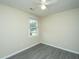 A bright bedroom featuring new floors, neutral walls, and a large window for ample natural light at 2003 Savage Rd, Charleston, SC 29407