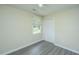 Bright bedroom featuring hardwood floors, a window for natural light, and a spacious closet at 2003 Savage Rd, Charleston, SC 29407
