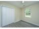 Bedroom featuring hardwood floors, a double door closet, and a window for natural light at 2003 Savage Rd, Charleston, SC 29407